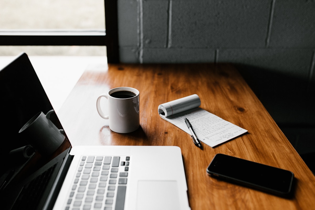 Private practice therapist reviewing AI-generated session notes on laptop